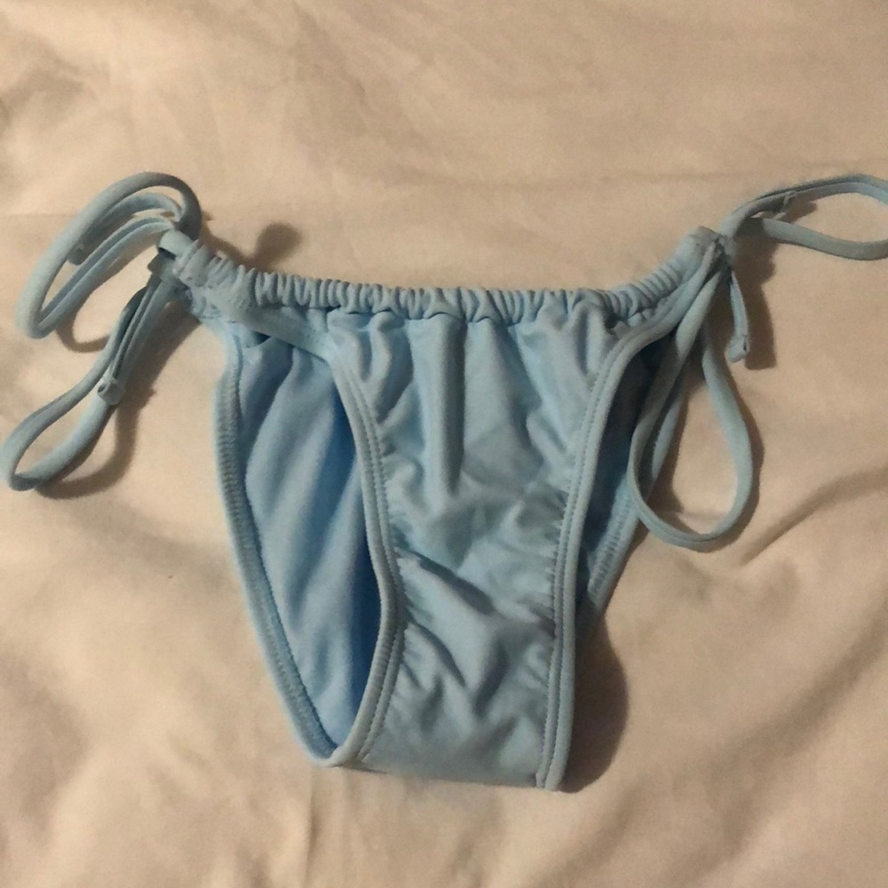 I am selling NEW never actually fully swam or worn these swim bottoms